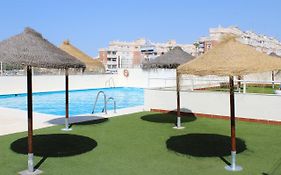SOL Y PLAYA ROQUETAS-Ático con piscina, solarium y garaje